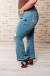 ONLINE EXCLUSIVE: Isla Mid Rise Distressed Released Hem Bootcut Jeans