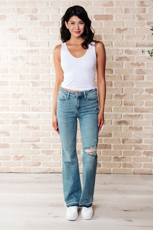 ONLINE EXCLUSIVE: Isla Mid Rise Distressed Released Hem Bootcut Jeans