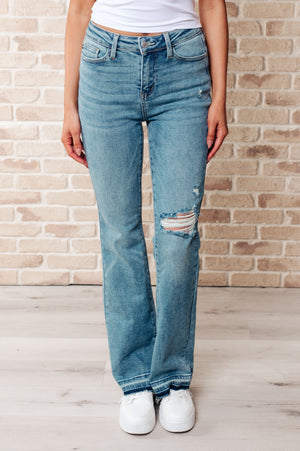 ONLINE EXCLUSIVE: Isla Mid Rise Distressed Released Hem Bootcut Jeans